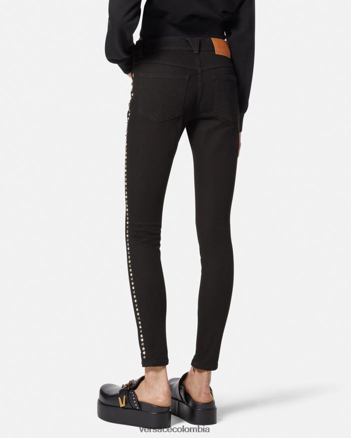 mujer jeans ajustados con tachuelas de Medusa Versace negro 2RP40F214 ropa